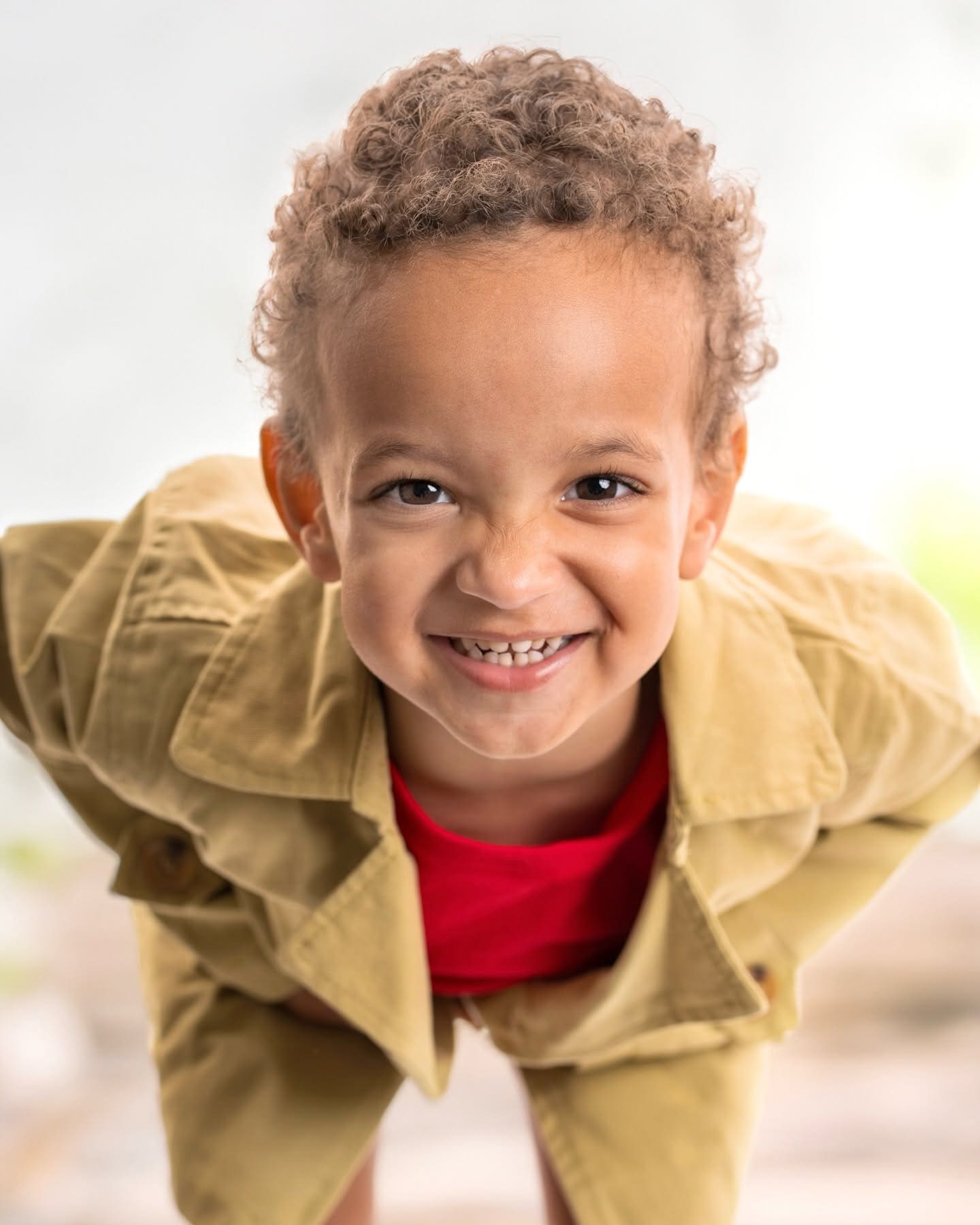Candid portrait of a child laughing in headphones